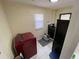 Bright laundry room with modern washer, dryer, and ample space at 1127 Enchanted Dr, Lakeland, FL 33801