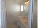 Clean bathroom with a vanity, sink, and a large mirror with vanity lighting at 11665 Sw 72Nd Cir, Ocala, FL 34476