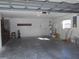 Spacious two car garage with concrete floor, laundry hookups, water heater, and garage door opener at 11665 Sw 72Nd Cir, Ocala, FL 34476