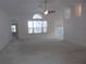 Bright and airy living room featuring vaulted ceilings and a large window, with new carpet at 11665 Sw 72Nd Cir, Ocala, FL 34476