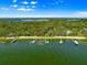 Beautiful aerial view of a waterfront home with private docks on a sunny day at 12336 E Highway 25, Ocklawaha, FL 32179