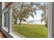 Backyard with a view of the lake and a private beach at 12336 E Highway 25, Ocklawaha, FL 32179