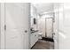 This bathroom includes a shower, toilet, vanity, and neutral color palette at 12336 E Highway 25, Ocklawaha, FL 32179