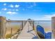 Wooden dock with a gazebo extending into the water, with stacked chairs at 12336 E Highway 25, Ocklawaha, FL 32179