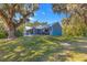 Charming home with a metal roof set in a large yard, offering a serene and private setting at 12336 E Highway 25, Ocklawaha, FL 32179