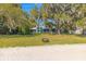 This home has a beautiful waterfront yard, with a fire pit and scenic lake views at 12336 E Highway 25, Ocklawaha, FL 32179