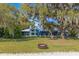 Home with metal roof and a fire pit in the yard near the beach and lake at 12336 E Highway 25, Ocklawaha, FL 32179