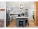 Spacious kitchen boasts modern appliances, granite countertops, and wood-look tile flooring at 12336 E Highway 25, Ocklawaha, FL 32179