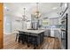 Stylish eat-in kitchen with granite island, stainless appliances, and pendant lighting at 12336 E Highway 25, Ocklawaha, FL 32179
