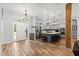 Open floor plan with kitchen featuring stainless steel appliances and a center island at 12336 E Highway 25, Ocklawaha, FL 32179