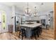 Beautiful kitchen with a center island, stainless steel appliances, and wood-look floors at 12336 E Highway 25, Ocklawaha, FL 32179
