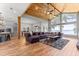 Spacious living room with water view, featuring vaulted ceilings and hardwood floors at 12336 E Highway 25, Ocklawaha, FL 32179