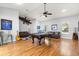 Spacious living room with ceiling fan, pool table, high ceilings and comfortable couches at 12336 E Highway 25, Ocklawaha, FL 32179