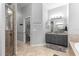 Neutral-toned bathroom with granite-look vanity top and a glass-enclosed stand up shower at 12336 E Highway 25, Ocklawaha, FL 32179