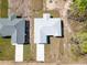 Bird's eye view of a neatly arranged home with driveway, roof, and tidy landscaping at 12876 Se 42Nd Ct, Belleview, FL 34420