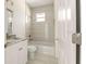 Modern bathroom with a luxurious vanity, and a shower-bath combination, creating a relaxing at-home spa at 12876 Se 42Nd Ct, Belleview, FL 34420
