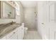 Modern bathroom with a luxurious vanity and a glass walk-in shower for a spa-like experience at 12876 Se 42Nd Ct, Belleview, FL 34420