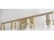 Modern bathroom lighting fixture featuring sleek gold hardware at 12876 Se 42Nd Ct, Belleview, FL 34420