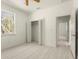 Bright bedroom featuring a large window, a bi-fold closet, and white walls creating a serene atmosphere at 12876 Se 42Nd Ct, Belleview, FL 34420