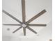 Modern ceiling fan featuring eight wooden blades and a central light fixture at 12876 Se 42Nd Ct, Belleview, FL 34420