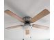 Ceiling fan featuring five light-colored wood blades at 12876 Se 42Nd Ct, Belleview, FL 34420