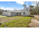 Charming one-story home showcasing its exterior, including attached garage, complemented by a well-maintained lawn at 12876 Se 42Nd Ct, Belleview, FL 34420