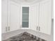 Kitchen cabinets with see through doors and long, stylish gold handles at 12876 Se 42Nd Ct, Belleview, FL 34420