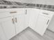New kitchen cabinets with long, stylish gold handles at 12876 Se 42Nd Ct, Belleview, FL 34420