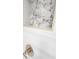 Shower niche with decorative stone tile and brushed nickel hardware at 12876 Se 42Nd Ct, Belleview, FL 34420
