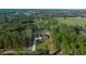 A picturesque aerial view of a charming home in a rural, wooded location at 13751 Sw 49Th Pl, Ocala, FL 34481