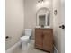 Bathroom featuring a wooden vanity, modern fixtures, and a neutral color scheme for a clean look at 13751 Sw 49Th Pl, Ocala, FL 34481