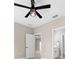 Bedroom featuring neutral colors, ceiling fan, access to bathroom and tile flooring at 13751 Sw 49Th Pl, Ocala, FL 34481