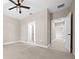 Bright bedroom featuring neutral paint, tile floors, and modern ceiling fan at 13751 Sw 49Th Pl, Ocala, FL 34481