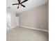 Spacious bedroom with tile flooring, ceiling fan and an ensuite bathroom with a large walk-in closet at 13751 Sw 49Th Pl, Ocala, FL 34481