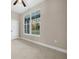 Bedroom with a large window providing abundant natural light at 13751 Sw 49Th Pl, Ocala, FL 34481