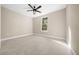 Neutral bedroom featuring a large window offering natural light and light tile flooring at 13751 Sw 49Th Pl, Ocala, FL 34481