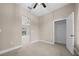 Neutral bedroom featuring an open closet, light tile flooring and ceiling fan at 13751 Sw 49Th Pl, Ocala, FL 34481