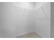Walk-in closet with shelving and tile flooring provides ample storage space at 13751 Sw 49Th Pl, Ocala, FL 34481