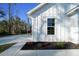 Close up view of home, showcasing flower bed and street number at 13751 Sw 49Th Pl, Ocala, FL 34481