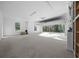 Spacious three car garage with bright lighting, offering plenty of space for vehicles and storage at 13751 Sw 49Th Pl, Ocala, FL 34481
