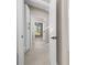 Hallway featuring access to the bathroom and bedroom at 13751 Sw 49Th Pl, Ocala, FL 34481