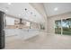 Open-concept kitchen featuring a large island, pendant lighting, and stainless steel appliances at 13751 Sw 49Th Pl, Ocala, FL 34481