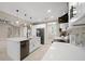Bright kitchen with stainless steel appliances, farmhouse sink, and an open layout at 13751 Sw 49Th Pl, Ocala, FL 34481