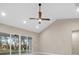 Living room boasting a modern ceiling fan, recessed lighting, and a view of the outdoors at 13751 Sw 49Th Pl, Ocala, FL 34481