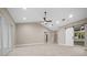 Bright living room featuring recessed lighting, neutral colors, and sliding glass doors at 13751 Sw 49Th Pl, Ocala, FL 34481