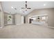 Spacious living area with a barn door, recessed lighting, and an open view of the modern kitchen at 13751 Sw 49Th Pl, Ocala, FL 34481