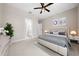 Main bedroom featuring tile flooring, ceiling fan and a bathroom at 13751 Sw 49Th Pl, Ocala, FL 34481