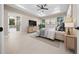 Well-appointed main bedroom with ensuite bathroom access, decorative tray ceiling, and neutral tones, providing a relaxing sanctuary at 13751 Sw 49Th Pl, Ocala, FL 34481