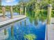 Picturesque boat dock with clear water views, featuring wooden pilings and a serene waterfront atmosphere at 19533 Sw 86Th Ln, Dunnellon, FL 34432