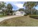 Attractive one-story home with mature landscaping, a paved driveway, and an attached two-car garage at 19533 Sw 86Th Ln, Dunnellon, FL 34432